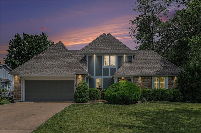 807 NW Bent Tree Dr, Lees Summit, MO 64081 - view of front of home with stone siding, a garage, driveway, and a shingled roof