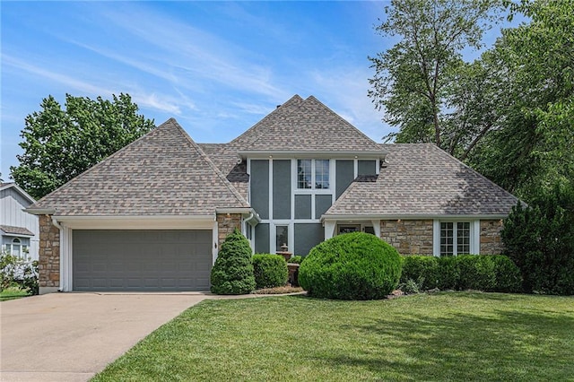 807 NW Bent Tree Dr, Lees Summit, MO 64081 - view of front facade featuring stone siding, an attached garage, roof with shingles, and a front lawn