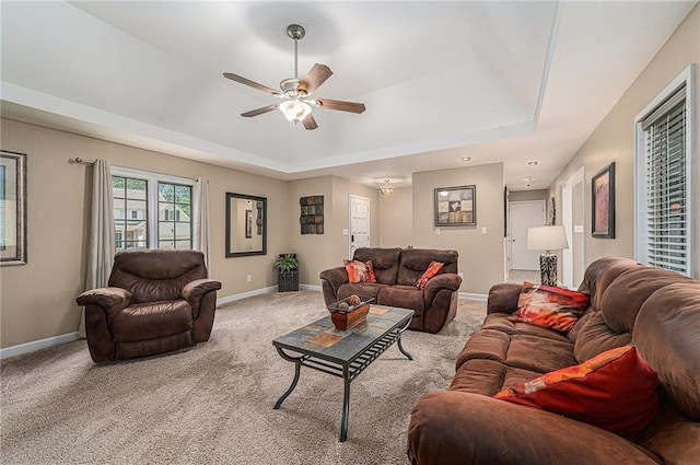 807 NW Bent Tree Dr, Lees Summit, MO 64081 - living area with a tray ceiling, a ceiling fan, and light carpet