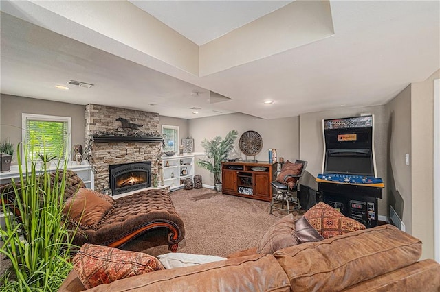807 NW Bent Tree Dr, Lees Summit, MO 64081 - carpeted living room with a stone fireplace and plenty of natural light