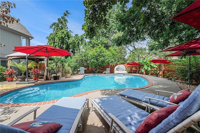 807 NW Bent Tree Dr, Lees Summit, MO 64081 - view of swimming pool featuring a fenced backyard and a patio