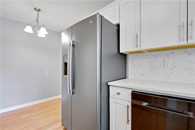 809 E 110th St, Kansas City, MO 64131 - kitchen featuring stainless steel fridge, black dishwasher, backsplash, and white cabinets