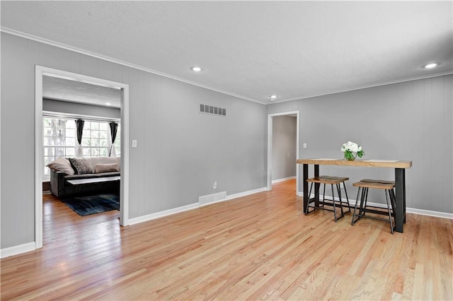 809 E 110th St, Kansas City, MO 64131 - spare room with ornamental molding, light wood-type flooring, and recessed lighting