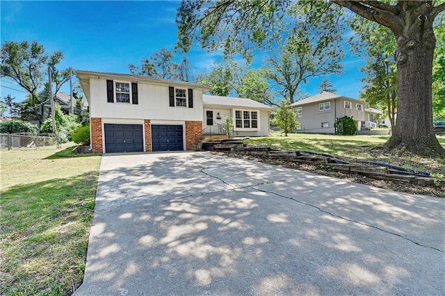 809 E 110th St, Kansas City, MO 64131 - tri-level home featuring brick siding, concrete driveway, and a garage