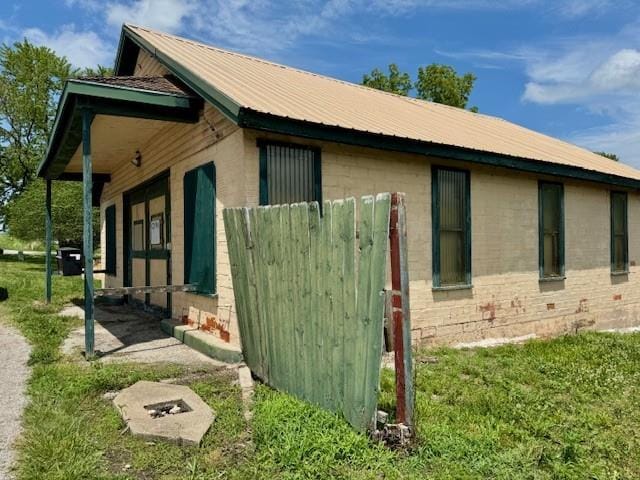 2745 169th Hwy, Trimble, MO 64492 - view of property exterior featuring concrete block siding and a metal roof