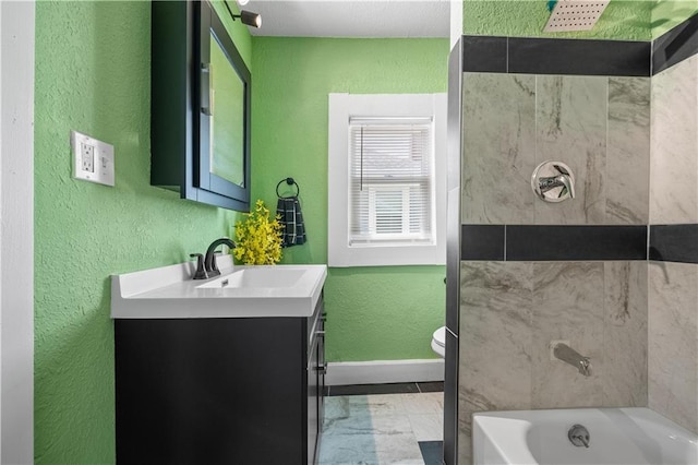 3230 Bellefontaine Ave, Kansas City, MO 64128 - full bathroom featuring vanity, a textured wall, and marble look tiles