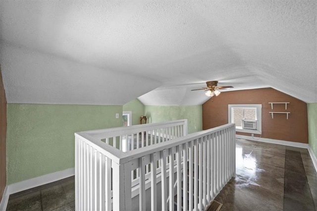 3230 Bellefontaine Ave, Kansas City, MO 64128 - bonus room featuring a textured ceiling, lofted ceiling, and ceiling fan