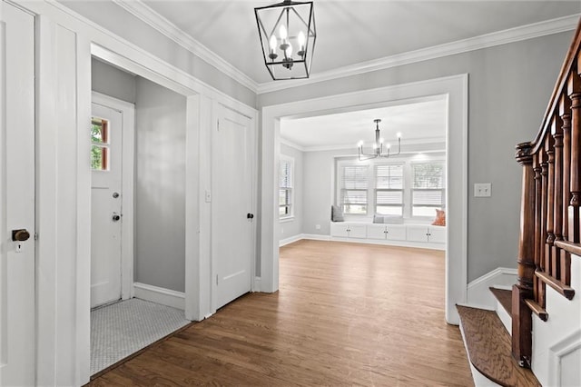 1535 W 75th St, Kansas City, MO 64114 - corridor featuring a chandelier, stairway, light wood-type flooring, plenty of natural light, and crown molding