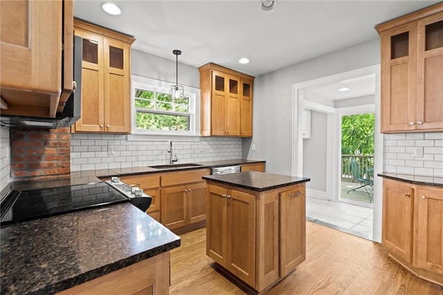 1535 W 75th St, Kansas City, MO 64114 - kitchen with backsplash, plenty of natural light, a kitchen island, recessed lighting, and light wood finished floors