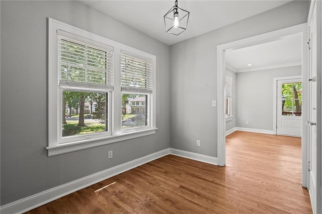 1535 W 75th St, Kansas City, MO 64114 - unfurnished room featuring wood finished floors and crown molding