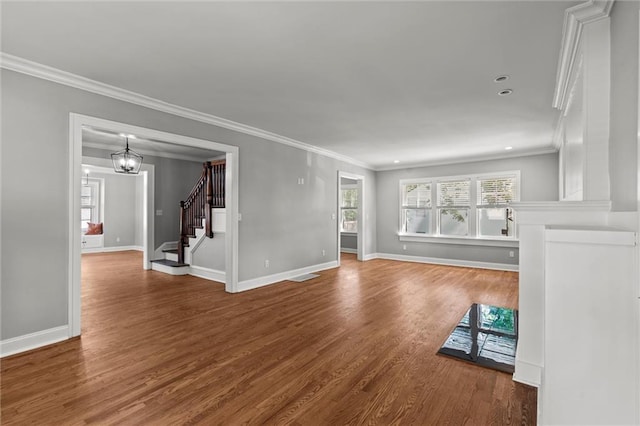 1535 W 75th St, Kansas City, MO 64114 - spare room featuring stairs, wood finished floors, crown molding, a chandelier, and recessed lighting