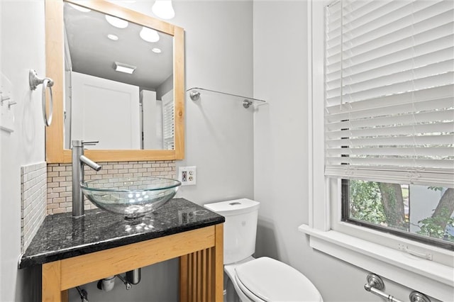 1535 W 75th St, Kansas City, MO 64114 - bathroom with tasteful backsplash and vanity