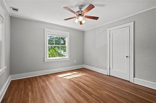 1535 W 75th St, Kansas City, MO 64114 - empty room featuring wood finished floors, a ceiling fan, and crown molding