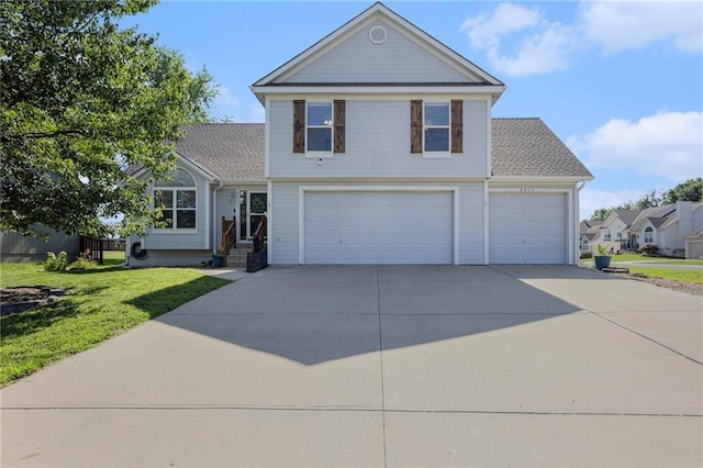2417 SW Woodhaven Ln, Lees Summit, MO 64082 - traditional-style house with driveway, a front lawn, an attached garage, and a garage