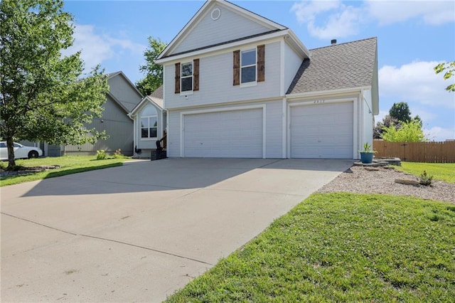 2417 SW Woodhaven Ln, Lees Summit, MO 64082 - traditional-style house featuring concrete driveway, an attached garage, roof with shingles, and a garage