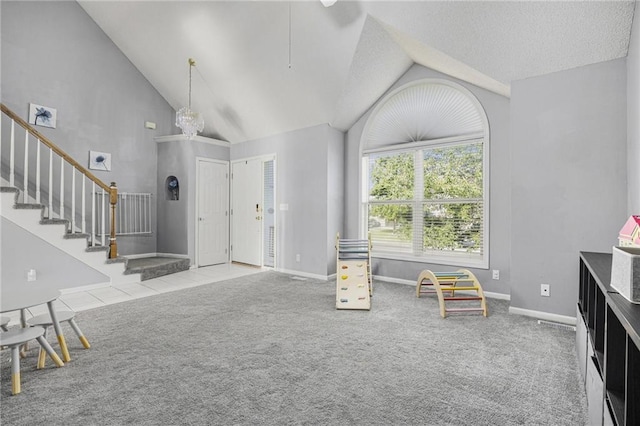 2417 SW Woodhaven Ln, Lees Summit, MO 64082 - entrance foyer with lofted ceiling, carpet flooring, and stairway