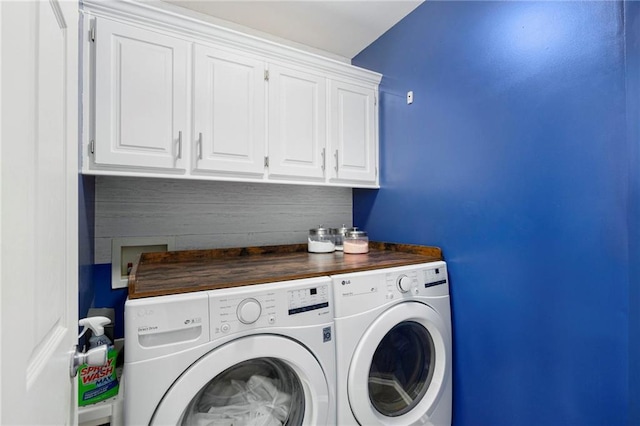 2417 SW Woodhaven Ln, Lees Summit, MO 64082 - laundry room featuring washing machine and dryer and cabinet space