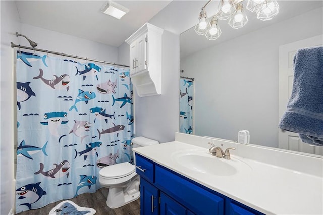 2417 SW Woodhaven Ln, Lees Summit, MO 64082 - full bath featuring wood finished floors, vanity, and a shower with shower curtain