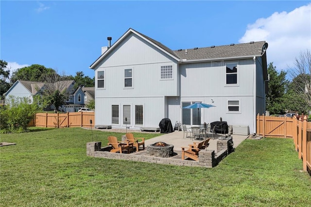 2417 SW Woodhaven Ln, Lees Summit, MO 64082 - back of property featuring an outdoor fire pit, a patio, a chimney, and a fenced backyard