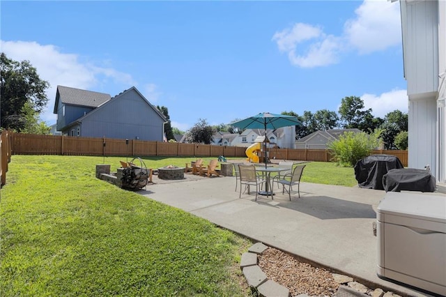 2417 SW Woodhaven Ln, Lees Summit, MO 64082 - fenced backyard featuring an outdoor fire pit and a patio