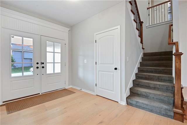 20487 W 108th St, Olathe, KS 66061 - entrance foyer featuring light wood finished floors and stairs
