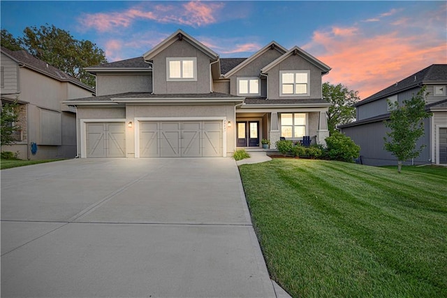 20487 W 108th St, Olathe, KS 66061 - view of front of home with concrete driveway, stucco siding, a front lawn, and a garage
