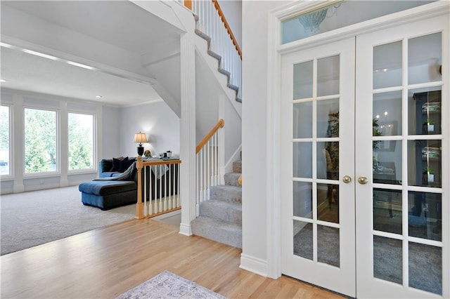 5010 W 161st Ter, Overland Park, KS 66085 - entryway featuring stairs, wood finished floors, french doors, and crown molding