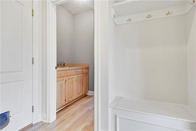 5010 W 161st Ter, Overland Park, KS 66085 - mudroom featuring light wood-style floors and a sink