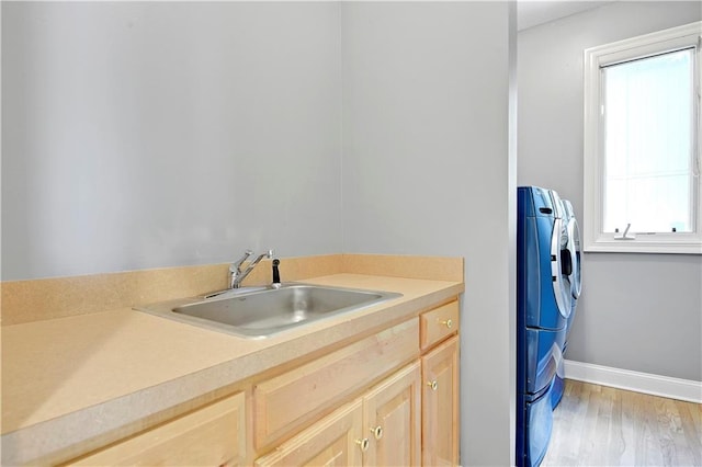 5010 W 161st Ter, Overland Park, KS 66085 - washroom featuring washing machine and clothes dryer and light wood-type flooring