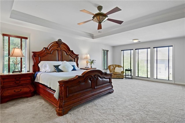 5010 W 161st Ter, Overland Park, KS 66085 - bedroom featuring a tray ceiling, light carpet, crown molding, and a ceiling fan
