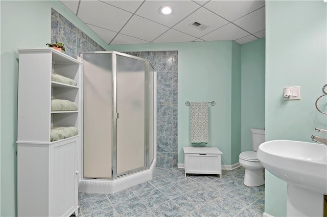 5010 W 161st Ter, Overland Park, KS 66085 - bathroom with a shower stall, tile patterned flooring, and a paneled ceiling