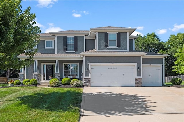 316 SE Hackamore Dr, Lees Summit, MO 64082 - view of front of house featuring driveway, stucco siding, stone siding, and covered porch
