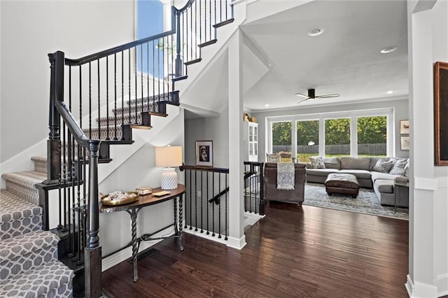 316 SE Hackamore Dr, Lees Summit, MO 64082 - stairs featuring wood finished floors, a ceiling fan, and recessed lighting
