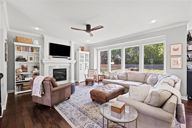 316 SE Hackamore Dr, Lees Summit, MO 64082 - living room with a ceiling fan, a glass covered fireplace, ornamental molding, dark wood-style floors, and recessed lighting