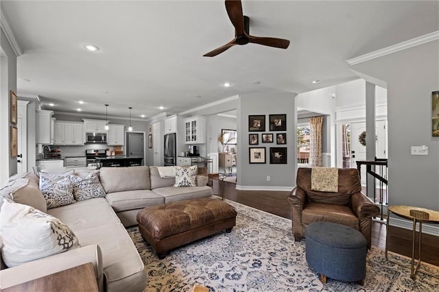 316 SE Hackamore Dr, Lees Summit, MO 64082 - living area with recessed lighting, a ceiling fan, wood finished floors, and ornamental molding