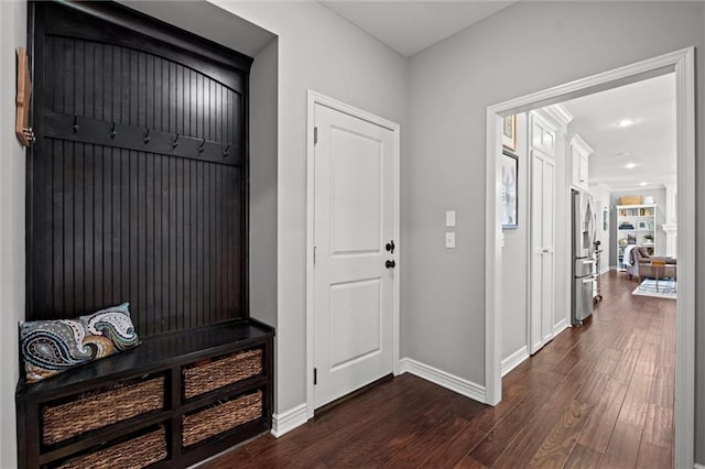 316 SE Hackamore Dr, Lees Summit, MO 64082 - mudroom with dark wood finished floors and baseboards