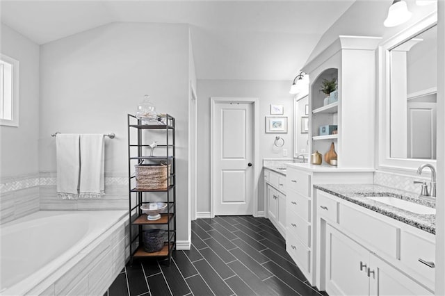316 SE Hackamore Dr, Lees Summit, MO 64082 - full bathroom with double vanity, a bath, and lofted ceiling