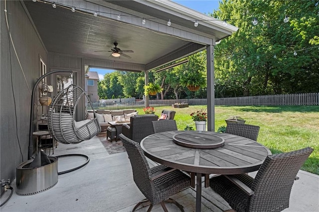 316 SE Hackamore Dr, Lees Summit, MO 64082 - fenced backyard with outdoor dining area, a ceiling fan, outdoor lounge area, and a patio area