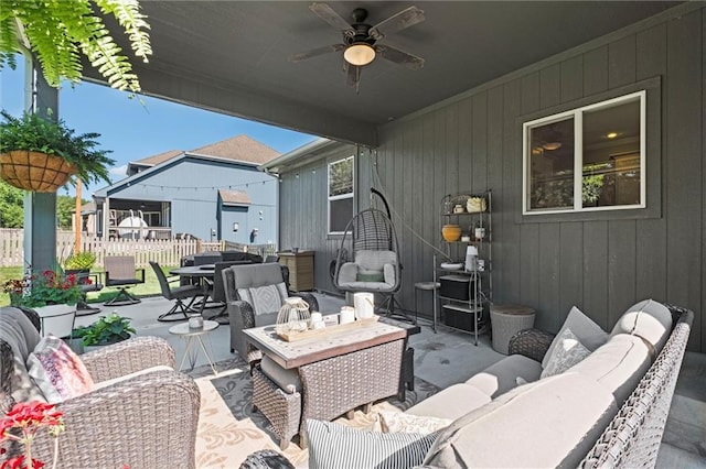 316 SE Hackamore Dr, Lees Summit, MO 64082 - view of patio featuring an outdoor living space, a ceiling fan, and outdoor dining space