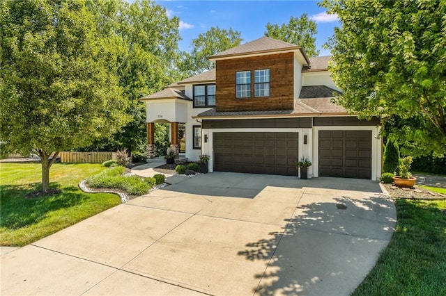 3536 SW Dana Ave, Lees Summit, MO 64082 - view of front of home with concrete driveway, roof with shingles, stucco siding, and an attached garage
