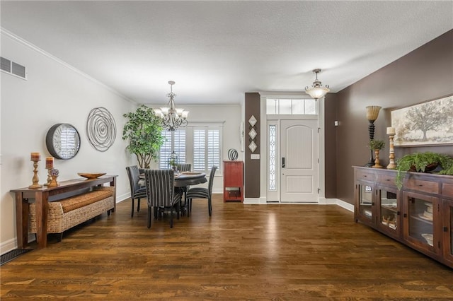 3536 SW Dana Ave, Lees Summit, MO 64082 - foyer with a chandelier, wood finished floors, and ornamental molding