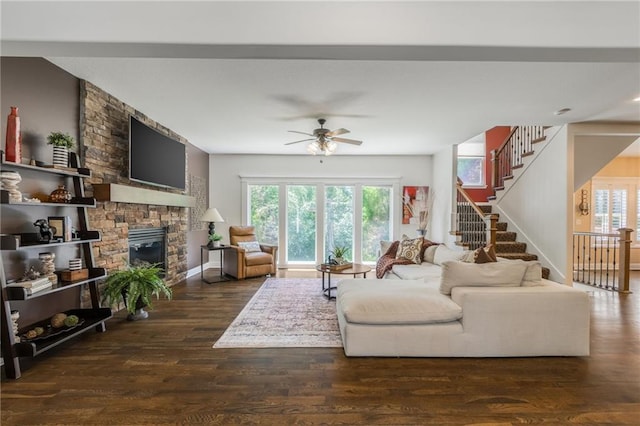 3536 SW Dana Ave, Lees Summit, MO 64082 - living area with healthy amount of natural light, a ceiling fan, a fireplace, and stairs