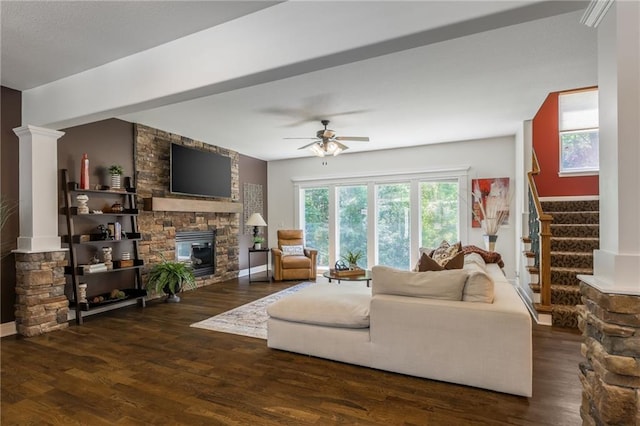 3536 SW Dana Ave, Lees Summit, MO 64082 - living room with a stone fireplace, ceiling fan, healthy amount of natural light, and wood finished floors