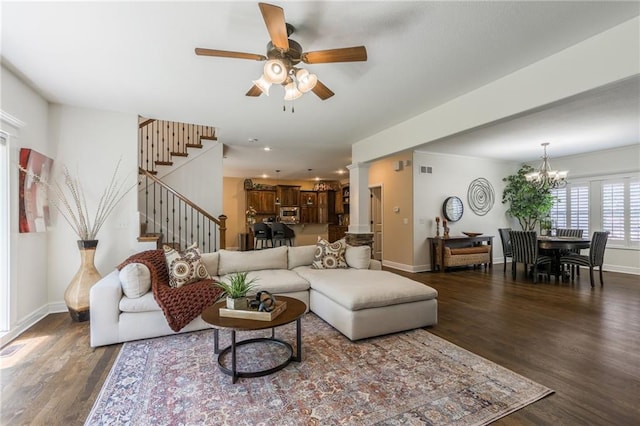 3536 SW Dana Ave, Lees Summit, MO 64082 - living room with wood finished floors, stairs, a ceiling fan, a chandelier, and recessed lighting