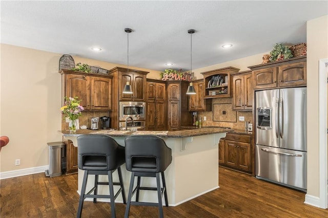 3536 SW Dana Ave, Lees Summit, MO 64082 - kitchen featuring appliances with stainless steel finishes, open shelves, a breakfast bar area, tasteful backsplash, and dark wood-type flooring