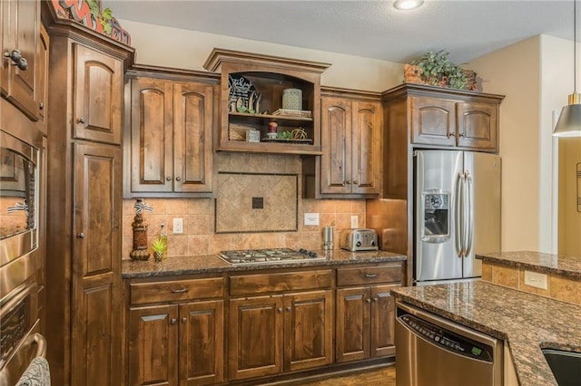 3536 SW Dana Ave, Lees Summit, MO 64082 - kitchen featuring stainless steel appliances, dark stone countertops, open shelves, and decorative backsplash