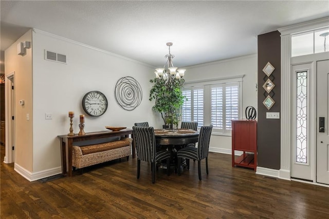 3536 SW Dana Ave, Lees Summit, MO 64082 - dining space featuring a chandelier, wood finished floors, and ornamental molding
