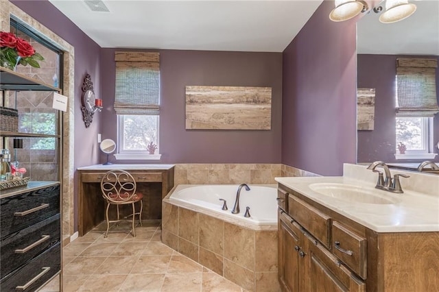3536 SW Dana Ave, Lees Summit, MO 64082 - bathroom with vanity, a garden tub, plenty of natural light, and tile patterned floors