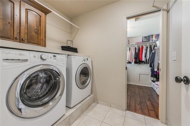 3536 SW Dana Ave, Lees Summit, MO 64082 - laundry room with separate washer and dryer, cabinet space, and light tile patterned floors