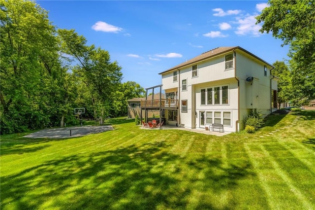 3536 SW Dana Ave, Lees Summit, MO 64082 - back of house featuring a patio area, a lawn, and a deck